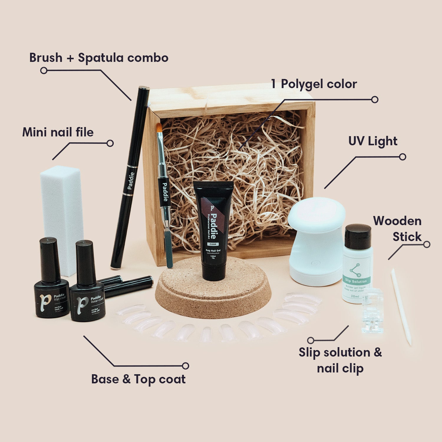 Polygel nail kit with essentials for DIY polygel nails. Includes 15g/0.5 oz polygel tube, nail clip, dual-ended nail brush and cuticle pusher combo, 20 dual form nail tips, slip solution, base and top coat, mini nail file, wooden stick, alcohol wipe, and UV lamp.